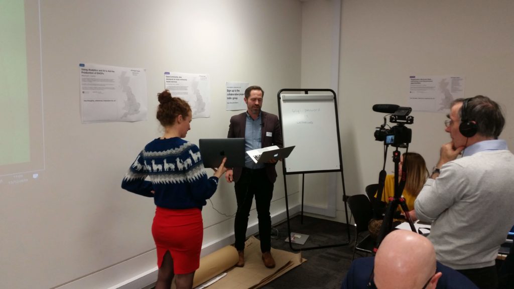 Picture of Paul Brewer introducing our OpenCommunity project at the launch of the LocalDigitalFund, with cameras filming.